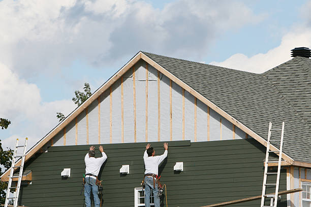 Professional Siding technician working in Street, MD